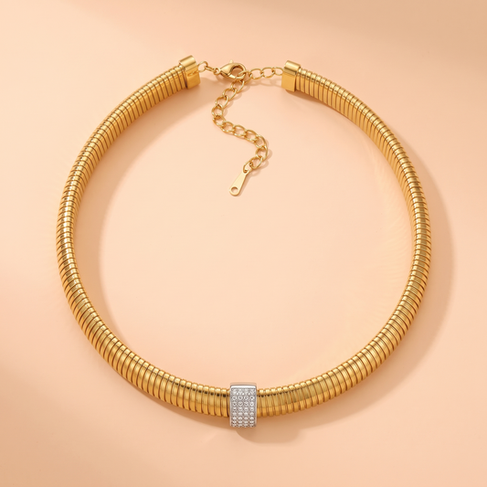 Stella Choker Gold flat lay on peach