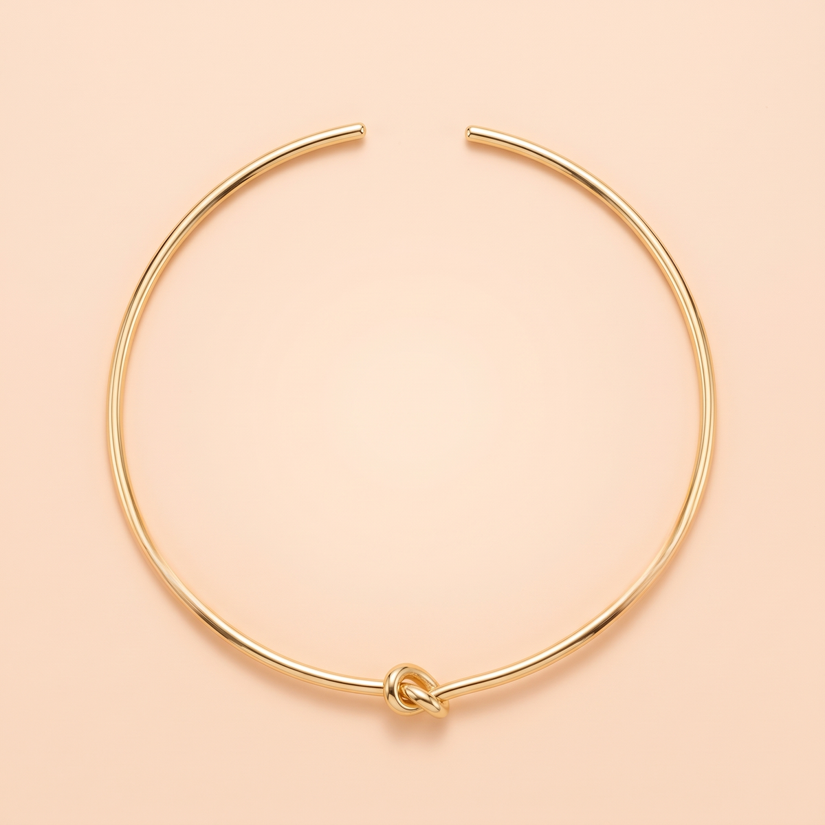 Promise Choker Gold flat lay on peach