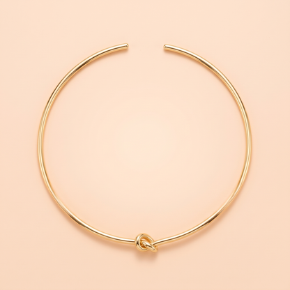 Promise Choker Gold flat lay on peach