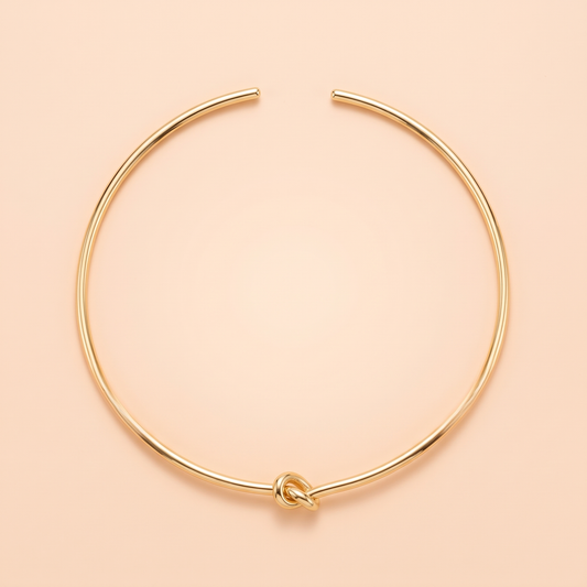 Promise Choker Gold flat lay on peach