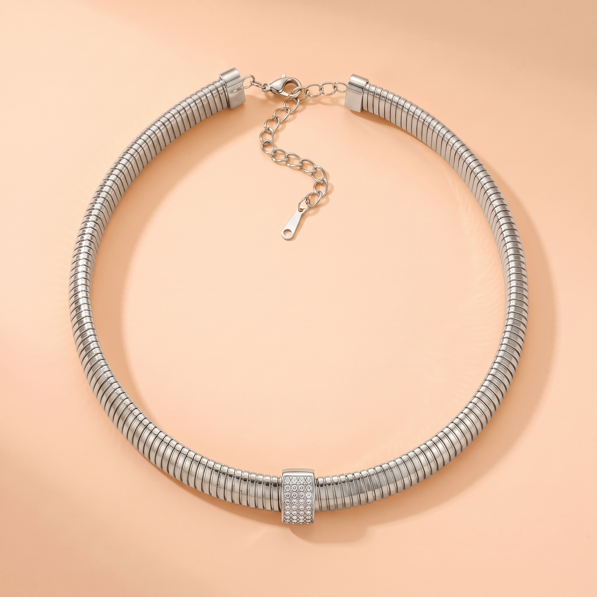 Stella Choker Silver flat lay on peach