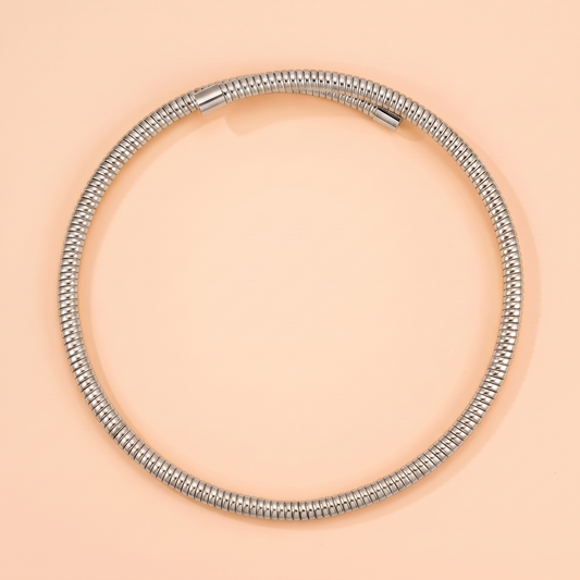 Spira Choker Silver flat lay on peach