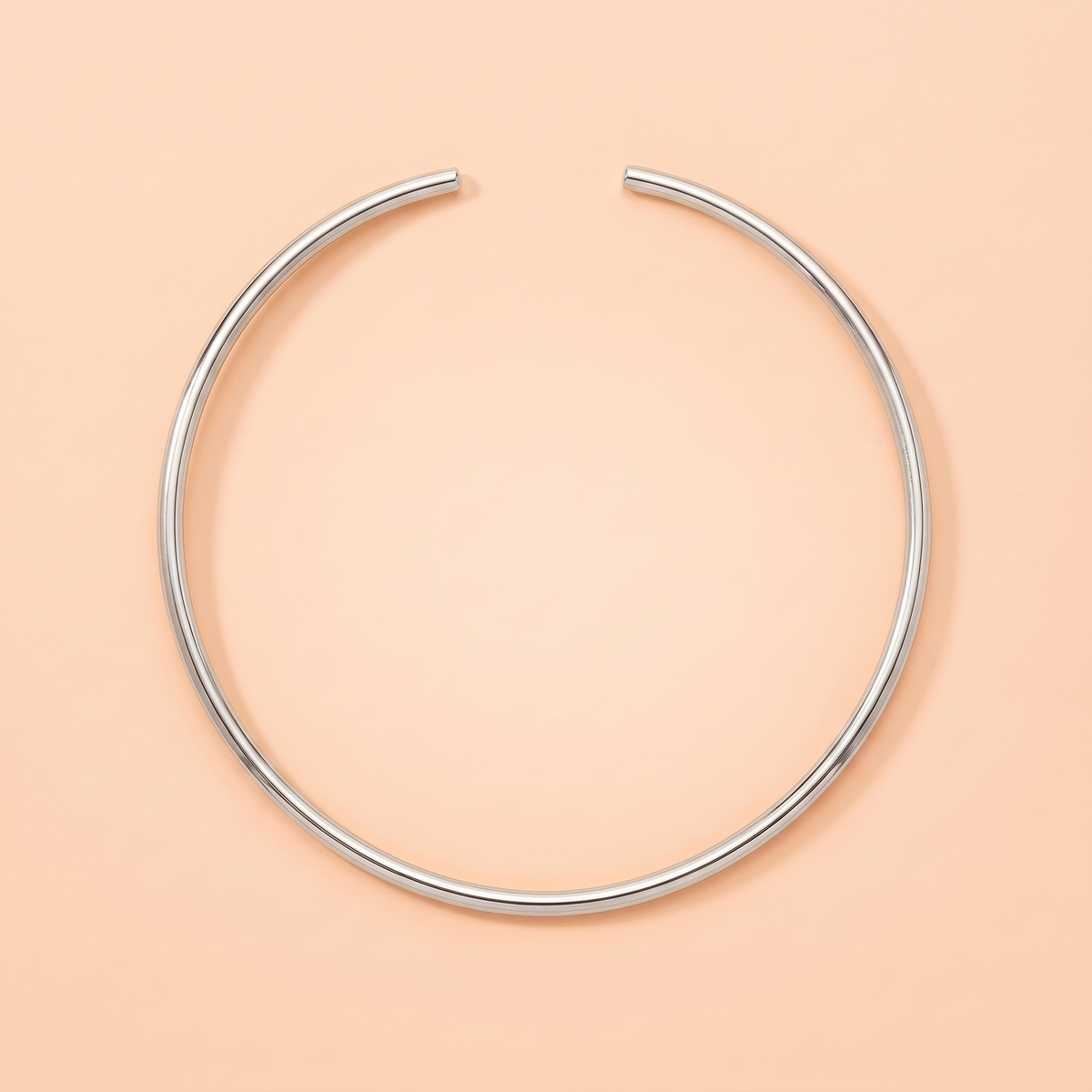 Luna Choker Silver flat lay on peach