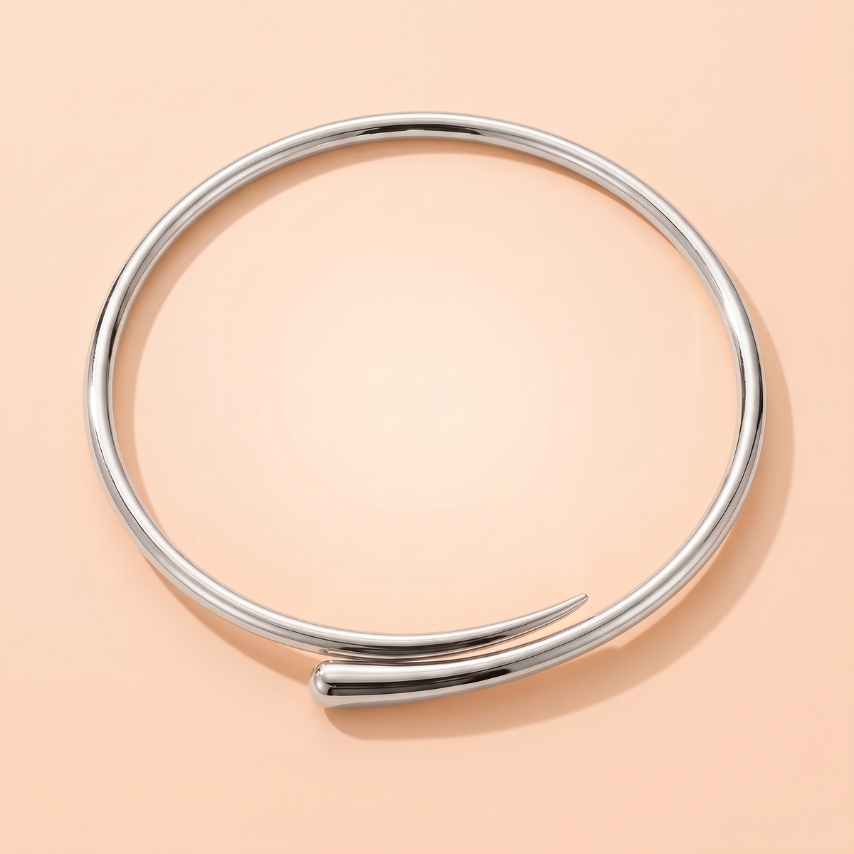 Volta Choker Silver flat lay on peach